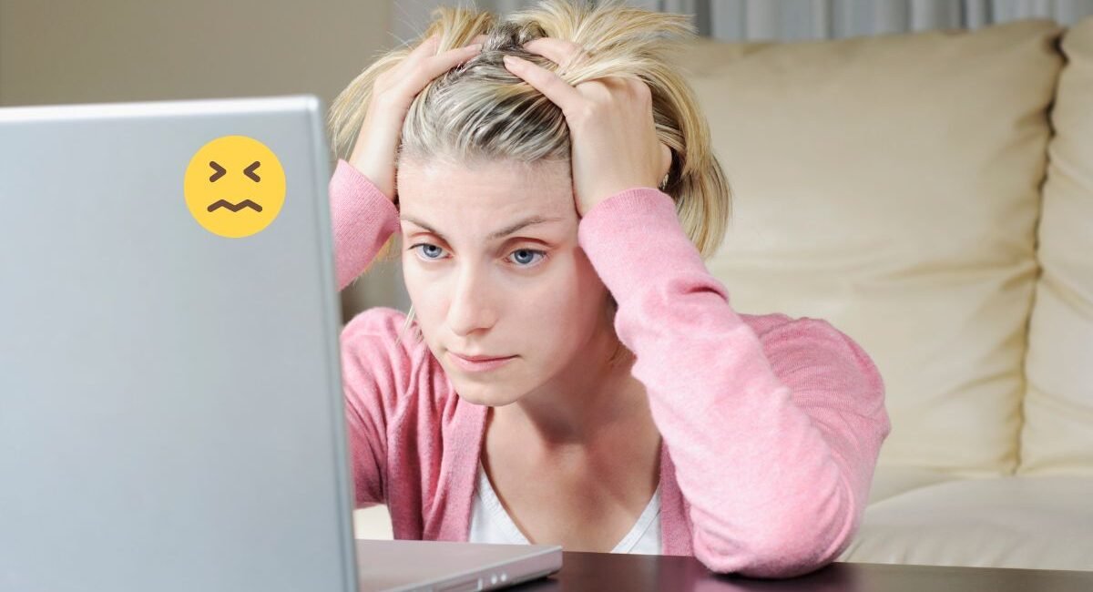 Frustrated person using a slow or malfunctioning computer