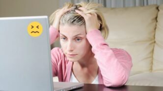 Frustrated person using a slow or malfunctioning computer