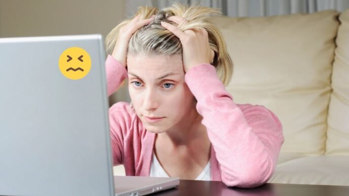 Frustrated person using a slow or malfunctioning computer